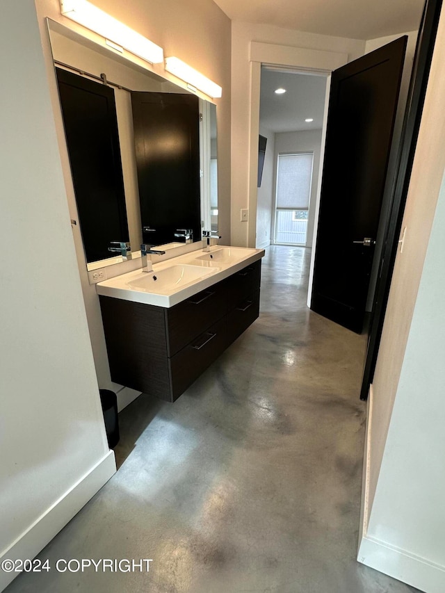 bathroom featuring vanity and concrete floors