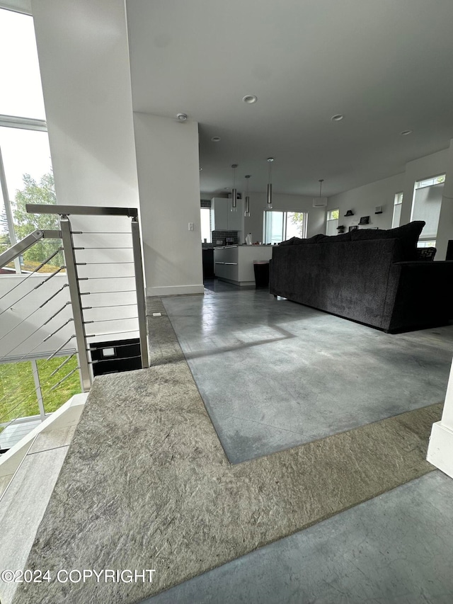 living room featuring concrete flooring