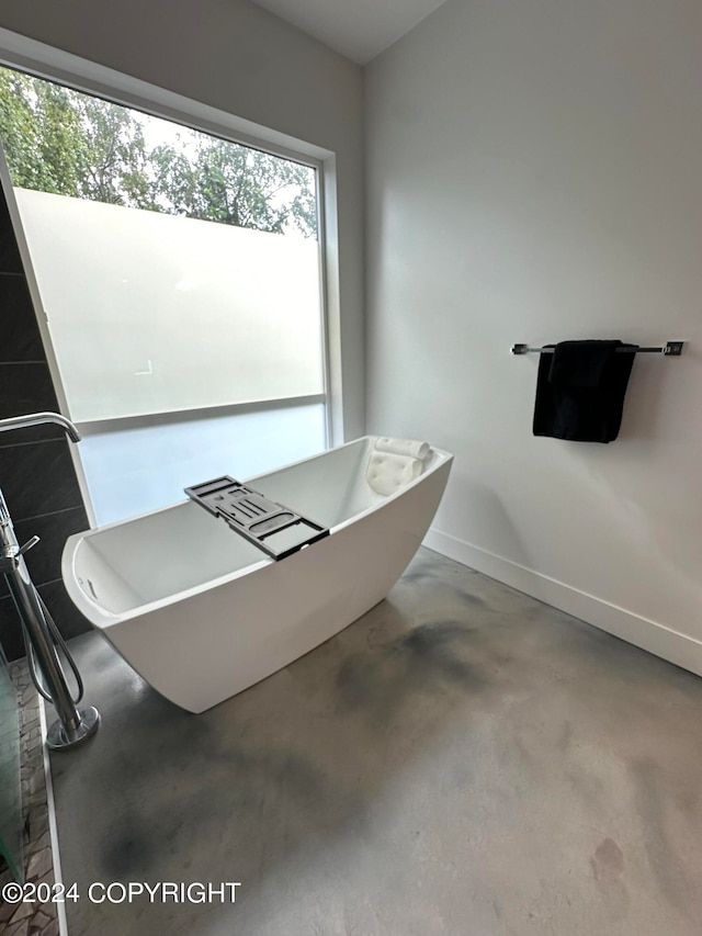 bathroom with a tub to relax in