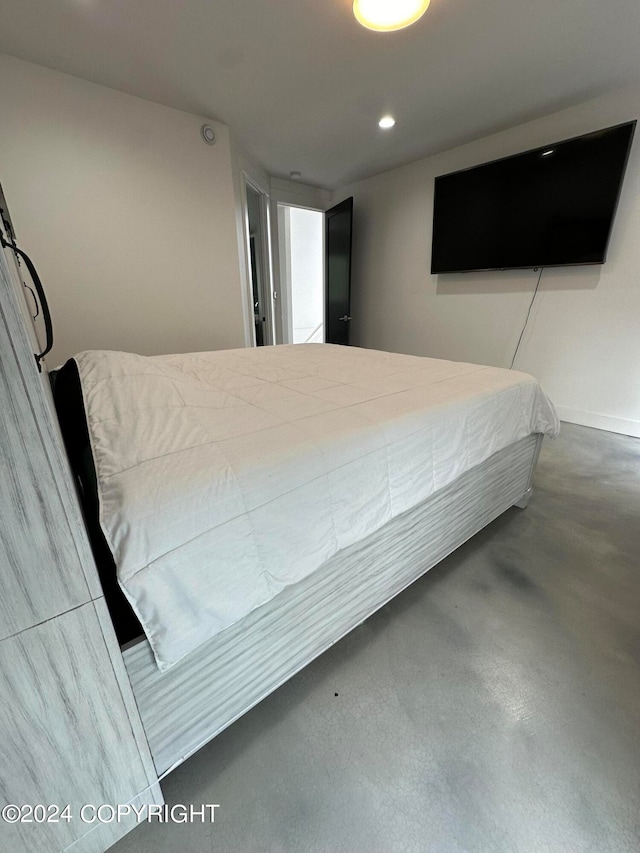 bedroom with concrete flooring