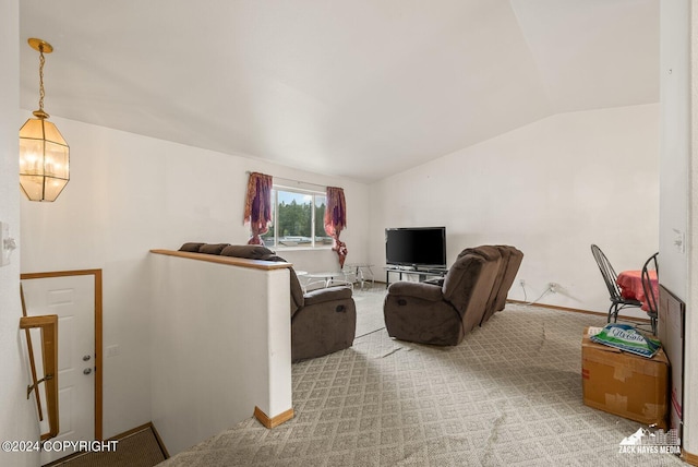 living room featuring lofted ceiling and light colored carpet