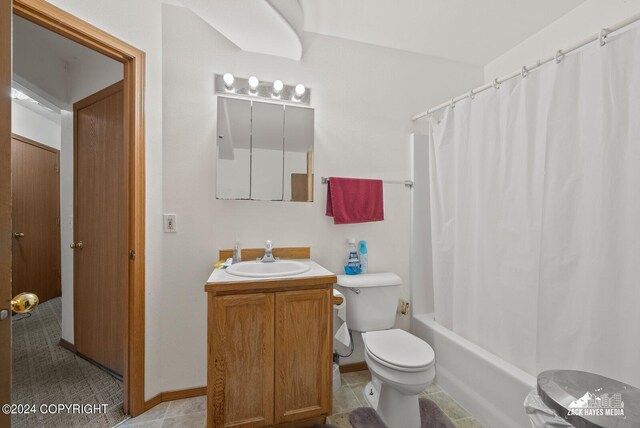 full bathroom featuring vanity, toilet, shower / tub combo, and tile patterned floors