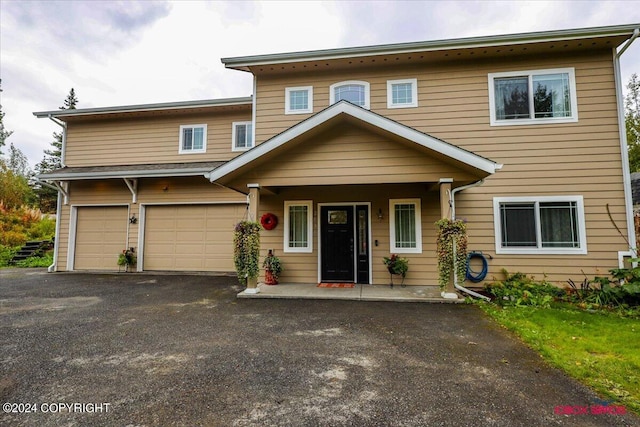 view of front of property with a garage