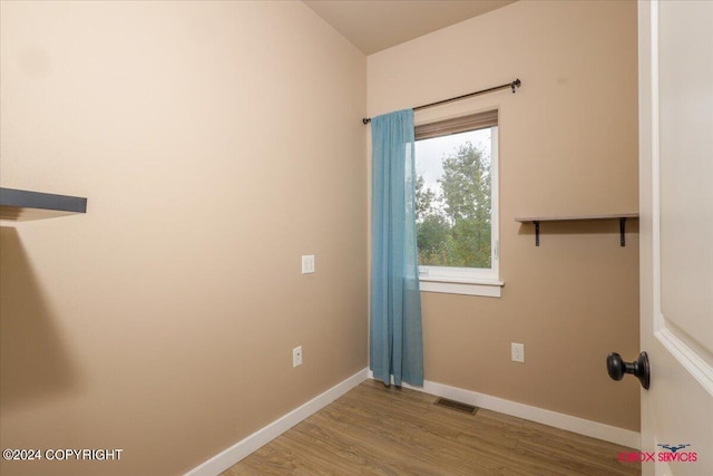 laundry room with light hardwood / wood-style flooring