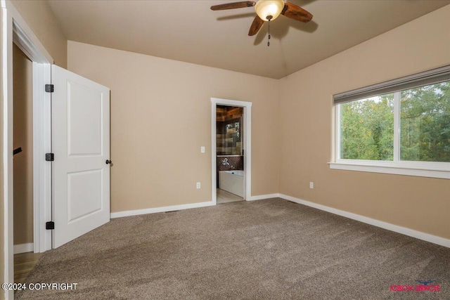 unfurnished bedroom featuring ceiling fan and carpet floors