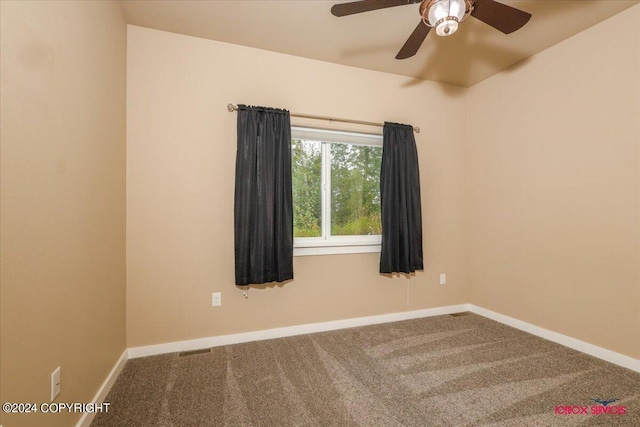 empty room featuring ceiling fan and carpet floors