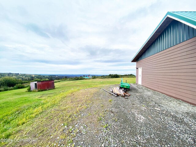 view of yard with a rural view