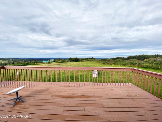 deck featuring a lawn