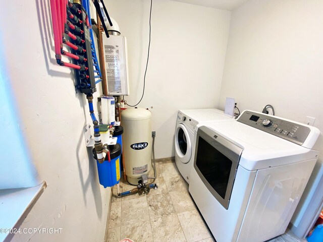 laundry area featuring washing machine and clothes dryer