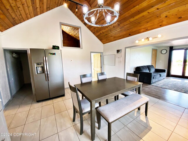 dining area featuring a notable chandelier, light hardwood / wood-style floors, high vaulted ceiling, and wooden ceiling