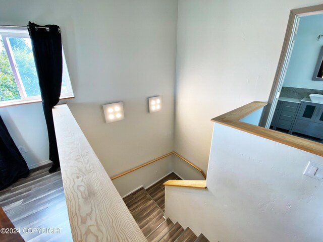 stairway with wood-type flooring