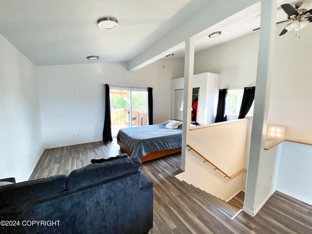 bedroom featuring lofted ceiling with beams, ceiling fan, access to exterior, and dark wood-type flooring