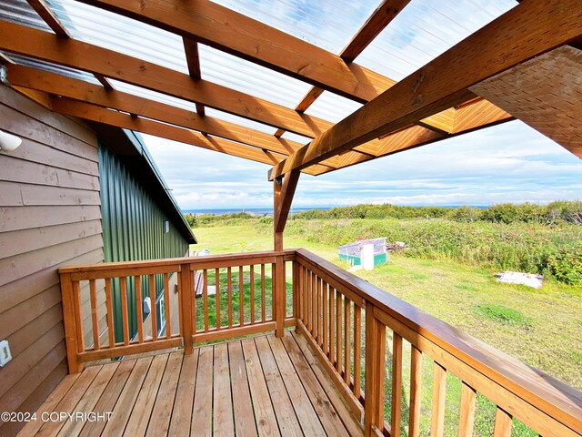 wooden deck with a rural view