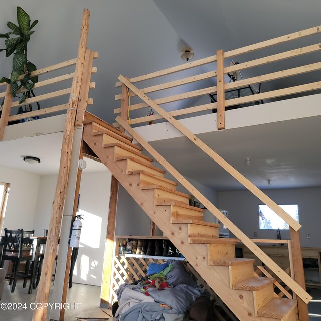 stairs with concrete flooring