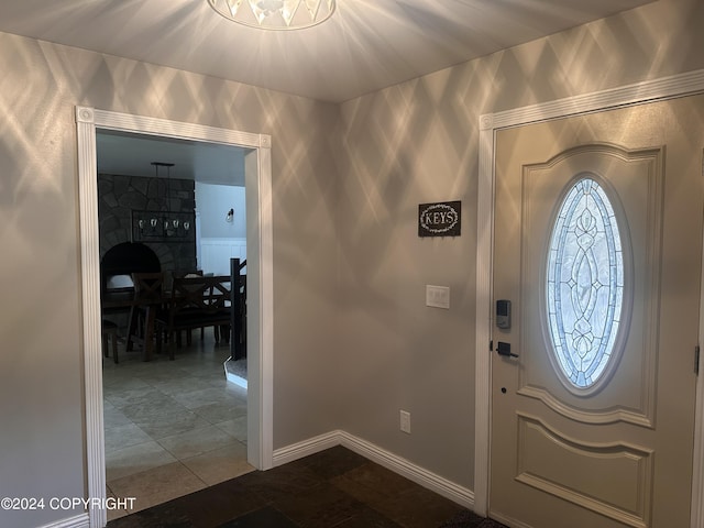 foyer entrance with baseboards