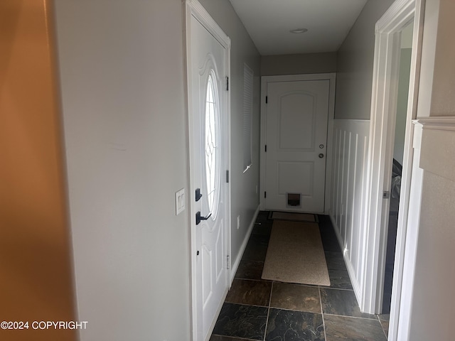 hall featuring stone finish flooring