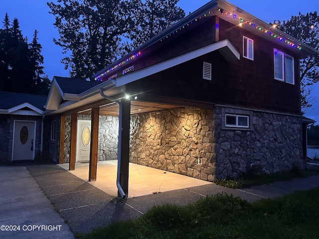 view of home's exterior with stone siding