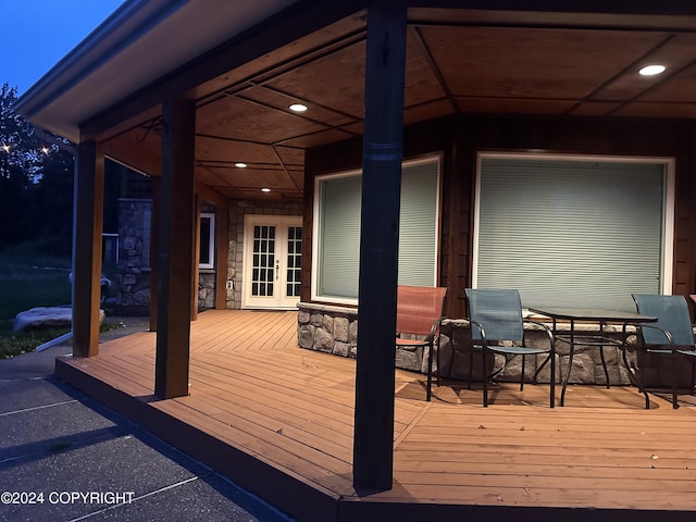 wooden deck featuring french doors