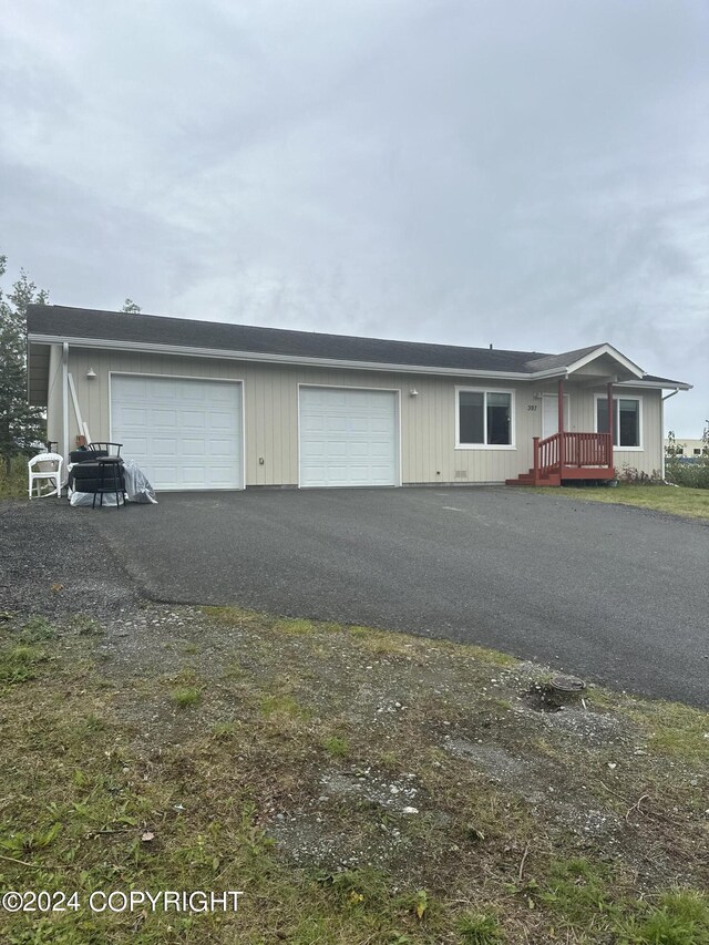 view of front facade with a deck and a garage