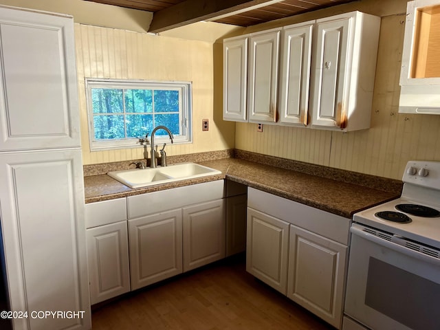 kitchen with white cabinets, hardwood / wood-style flooring, white range with electric cooktop, sink, and beam ceiling