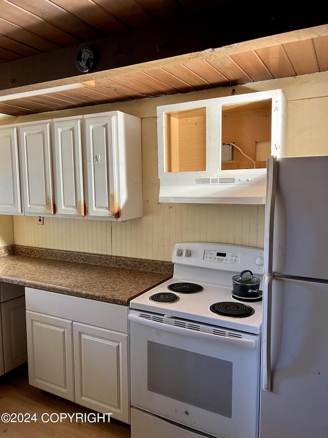 kitchen with white appliances, dark hardwood / wood-style flooring, white cabinetry, and wooden ceiling