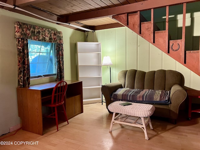 living area with wooden ceiling, wood-type flooring, and beam ceiling