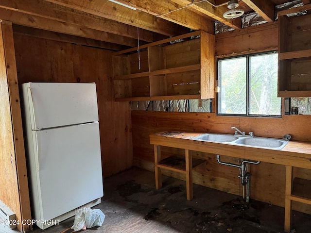 kitchen featuring white fridge and sink