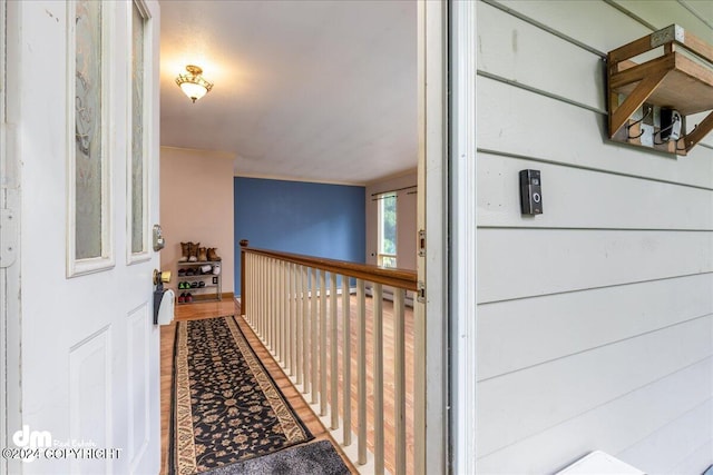 corridor featuring hardwood / wood-style floors