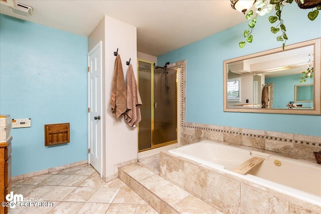 bathroom featuring a textured ceiling, vanity, and separate shower and tub