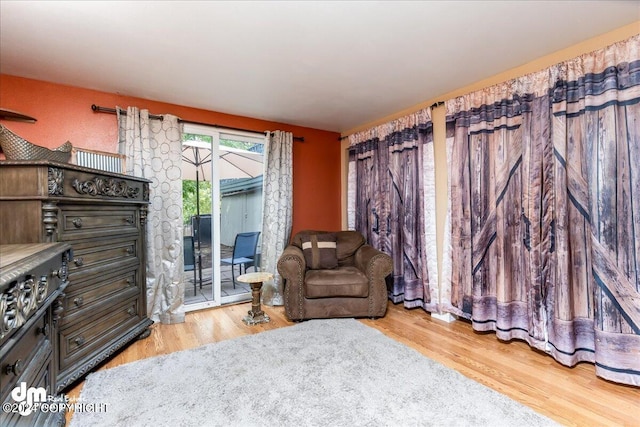 sitting room with light hardwood / wood-style flooring