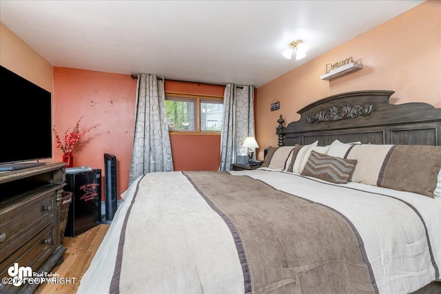 bedroom with light wood-type flooring