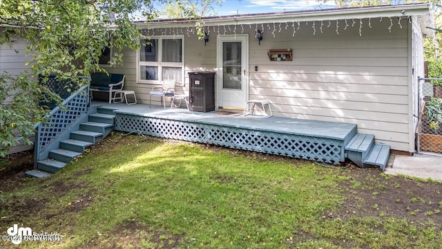 rear view of house with a lawn