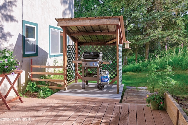 deck featuring a grill