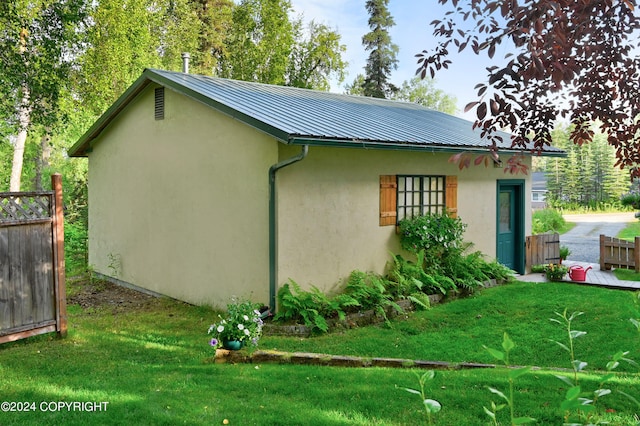 view of property exterior featuring a yard