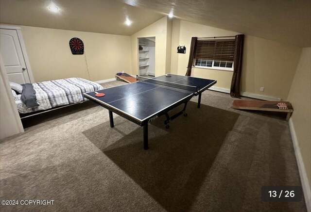 playroom with vaulted ceiling and carpet