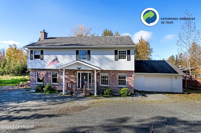 view of front of home featuring a porch and a garage