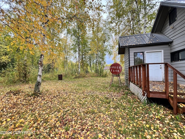 view of yard featuring a wooden deck