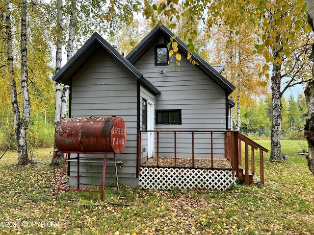 rear view of property with a deck