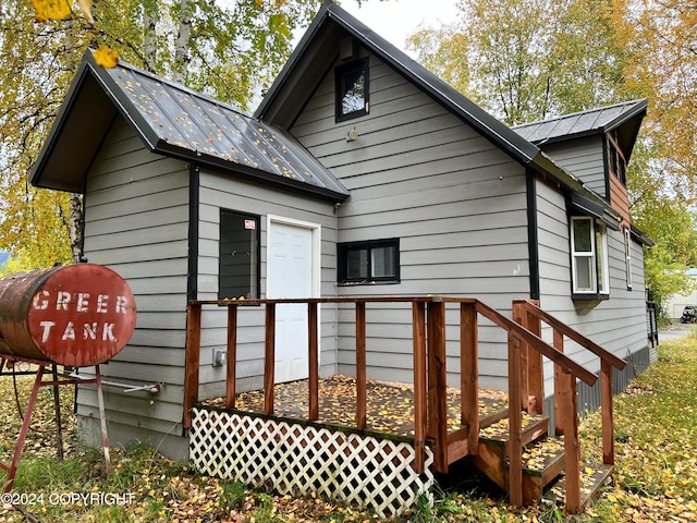 view of side of property with a deck