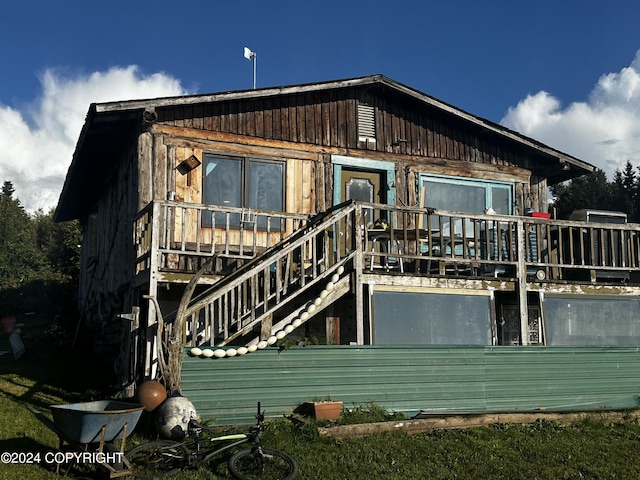 rear view of house with a wooden deck