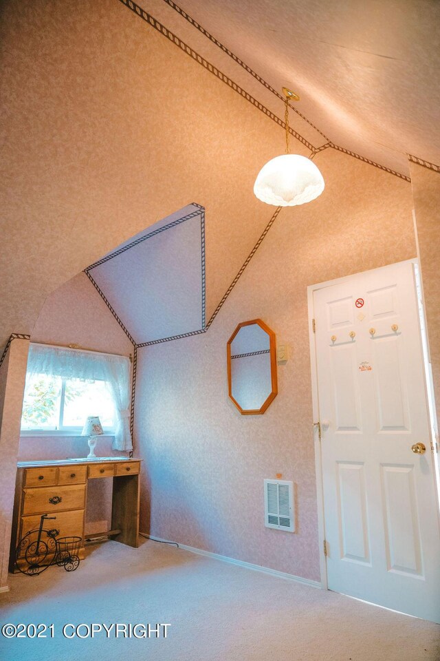 bonus room featuring vaulted ceiling