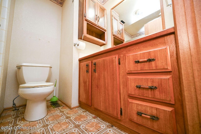 bathroom with toilet and tile patterned floors