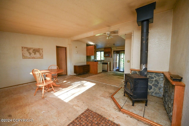 interior space with ceiling fan