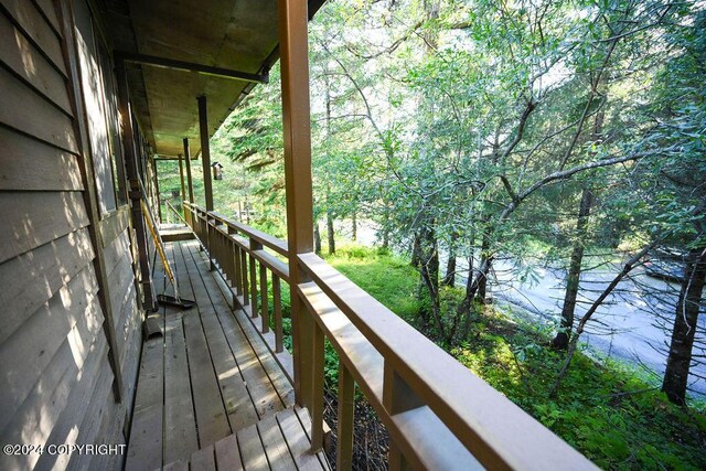 wooden terrace with a water view