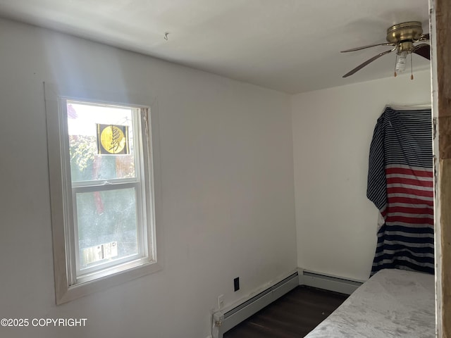 unfurnished bedroom with dark wood-style floors and ceiling fan