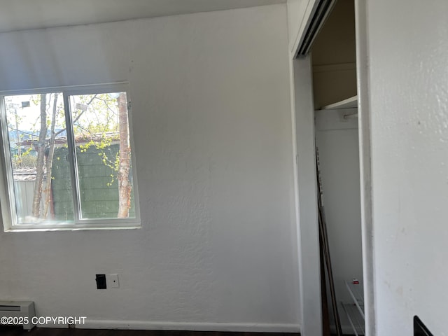 unfurnished bedroom featuring multiple windows