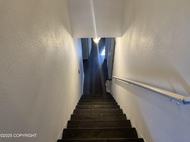 stairway with a textured wall