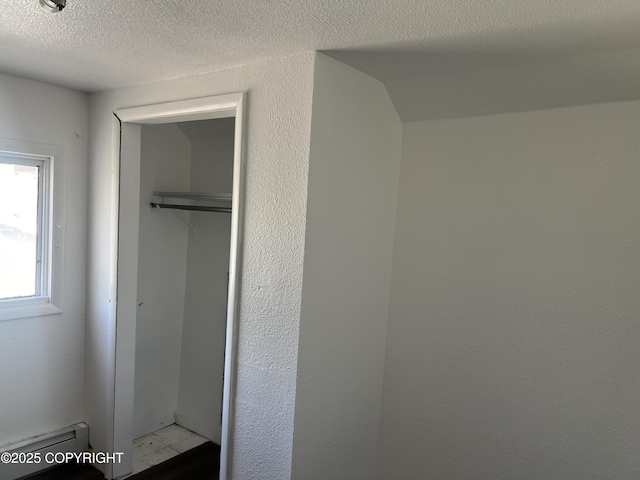 closet featuring a baseboard radiator