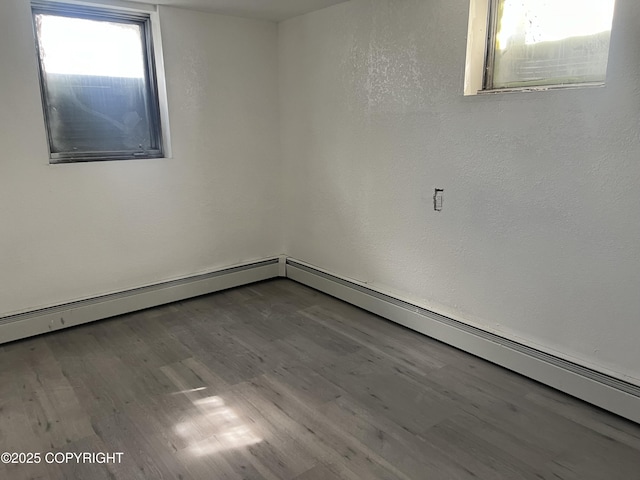 spare room featuring wood finished floors