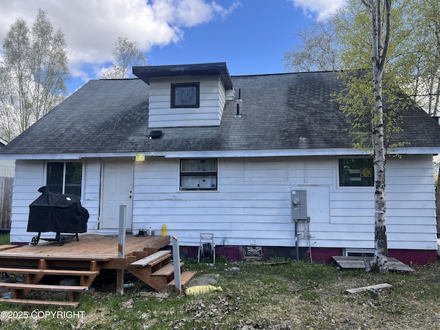 back of property featuring a deck